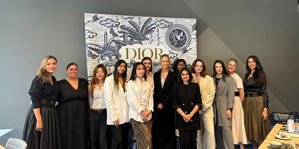 CUA women standing in a row in DIOR office