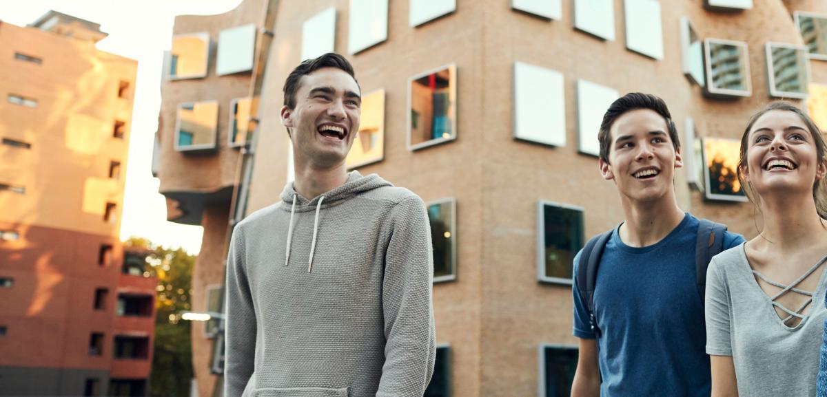 Students outside Frank Gehry designed CUA Business School