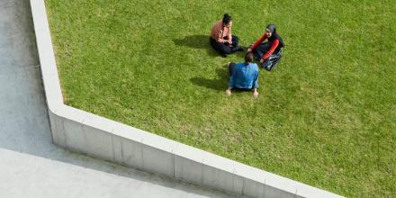 Students socialising and relaxing at CUA alumni green