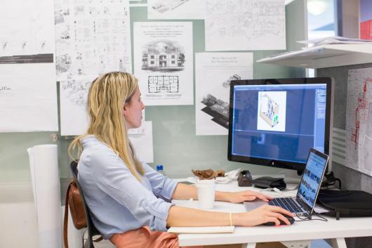 Architecture studios, student at computer desk 