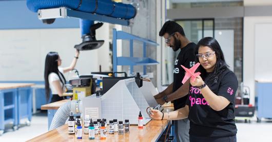 Three students at work in the CUA ProtoSpace