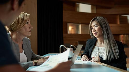 two women students at a desk