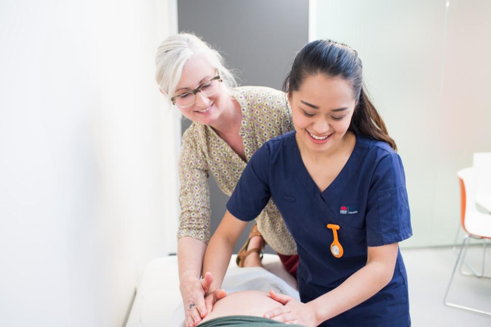 teacher assists a students feeling a bump