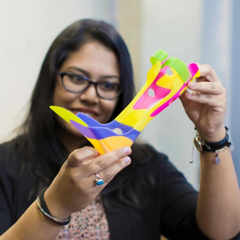 CUA researcher inspects a 3D-printed shoe